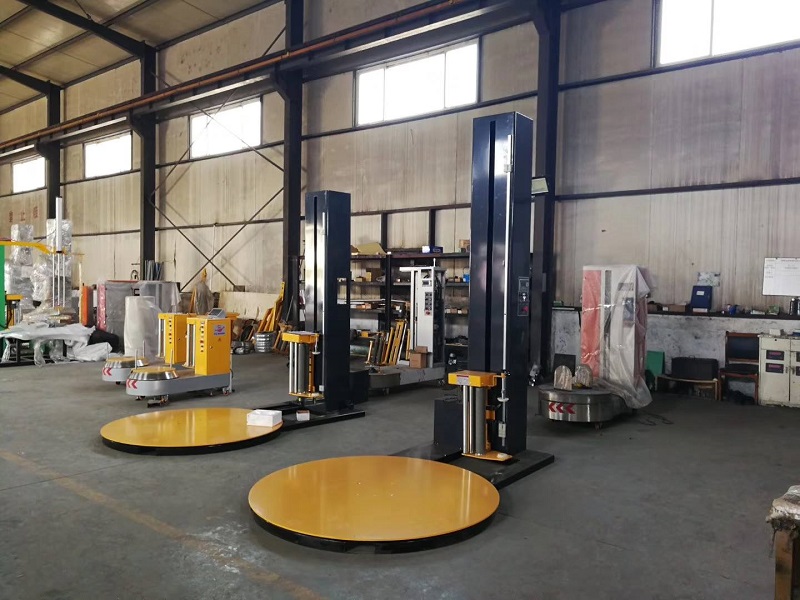 Two pallet wrapping machines in warehouse